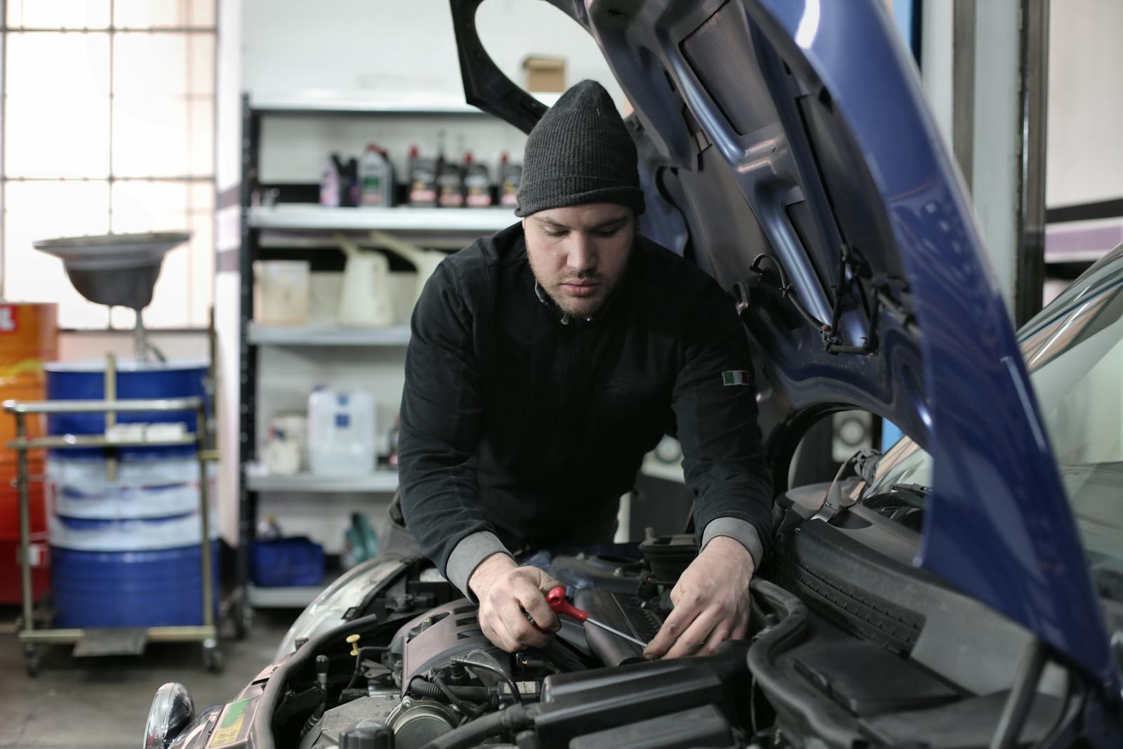 Technician performing mobile vehicle maintenance